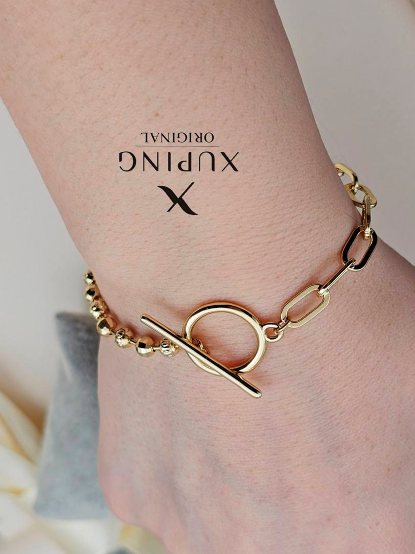 Xuping Original — kombinatsiyali oltin rangli bilakuzuk (toggle qulf) of14d